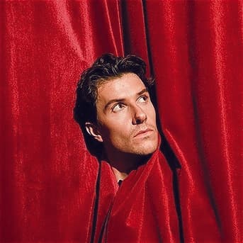 Sorry: A Canadian's Apology for America poster which shows comedian-filmmaker Connor Malbeuf sticking his head out of a red velvet curtain.