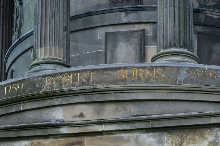 The Burns Monument on Calton Hill in Edinburgh - a large stone monument dedicated to Scotland's national poet Robert Burns, the inscription reads "1759 Robert Burns 1796"