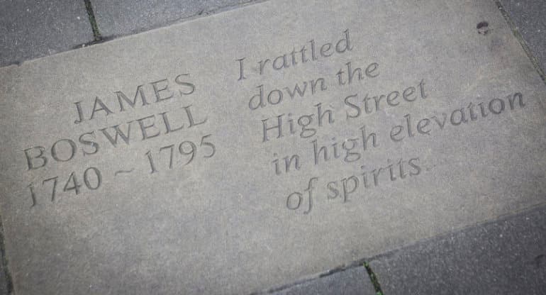 Inscribed flagstone on the ground at Makar's Court in Edinburgh featuring words by the writers James Boswell "I rattled down the High Street in high elevation of spirits"