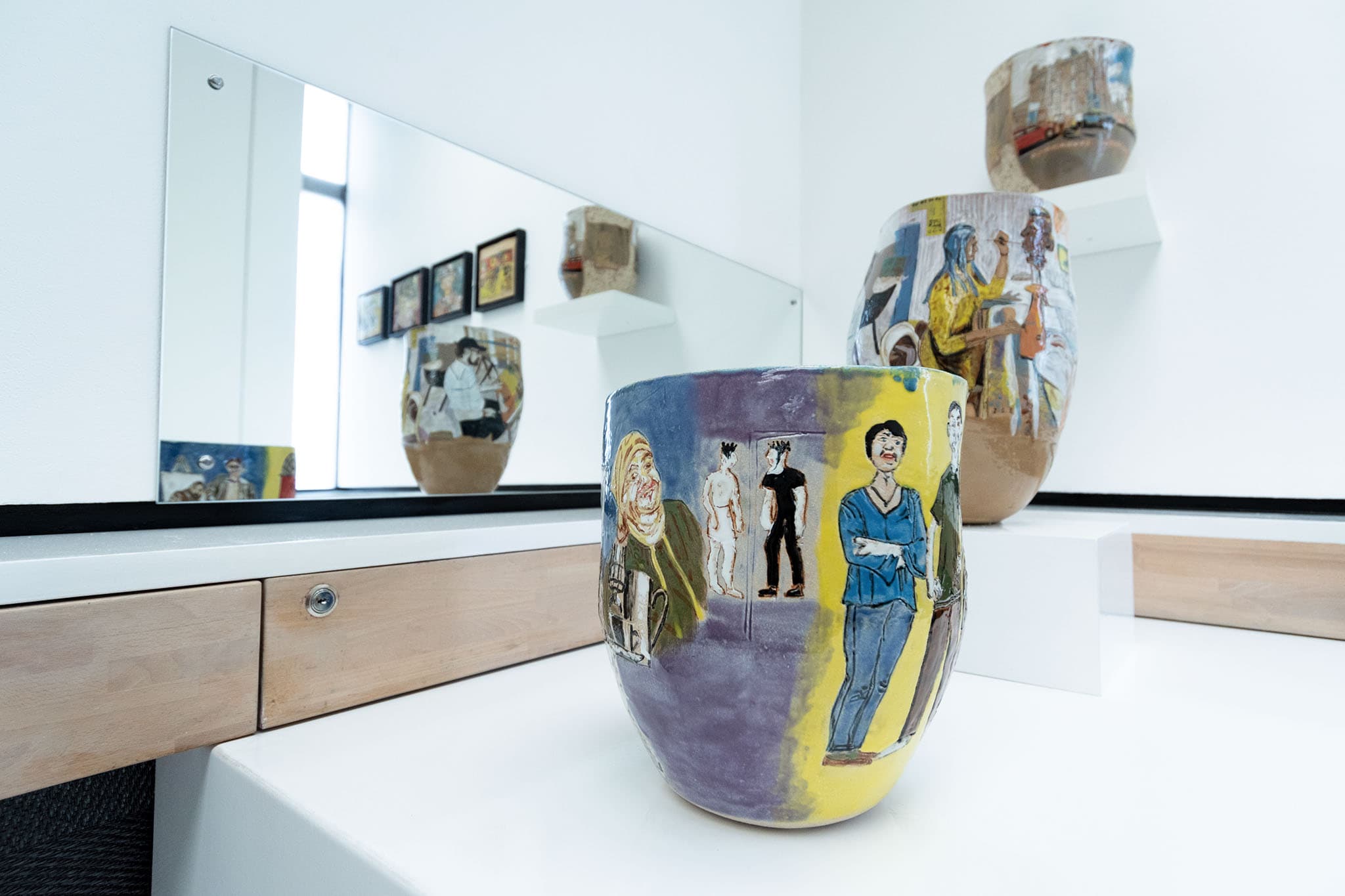 A white countertop with a vase positioned on top, showcasing a simple decor