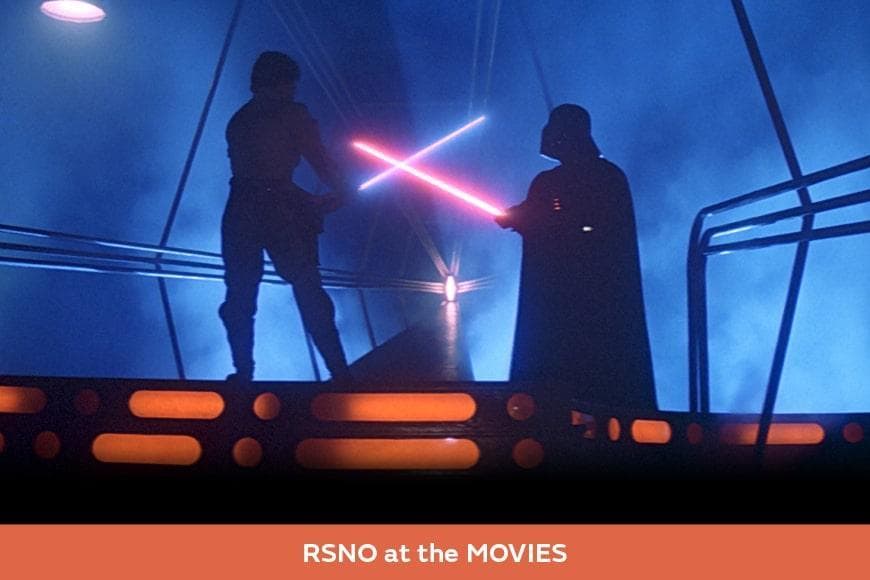 Still from the movie The Empire Strikes Back featuring Darth Vader and Luke Skywalker fighting with light sabres