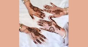 4 hands with henna tattoos